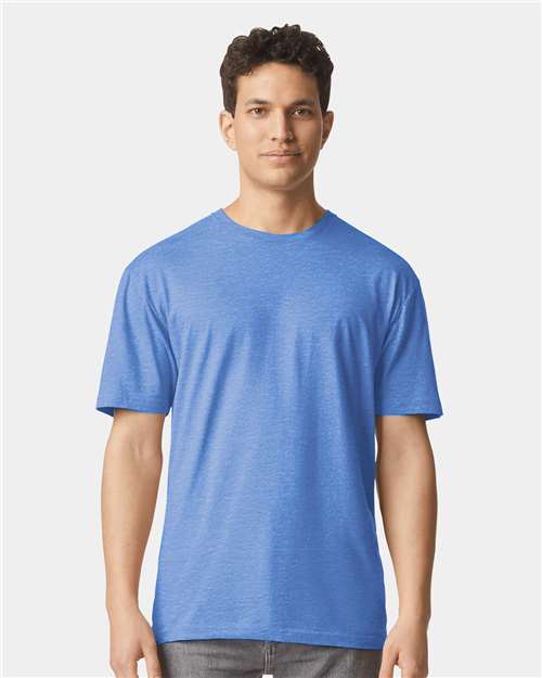 Unisex Softstyle T-shirt in blue with crew neck and short sleeves, worn by model
